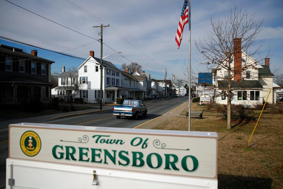 In this Jan. 28, 2019, photo, a motorist drives past a welcome sign in Greensboro, Md. A black teenager's death in police custody has roiled this rural town on Maryland's Eastern Shore and left a grief-stricken family yearning for answers to their lingering questions. (AP Photo/Patrick Semansky)