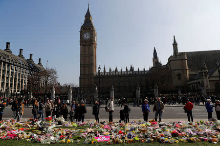 Floral tributes lie in Parliament Square following the attack in Westminster, central London, Britain March 27, 2017. REUTERS/Stefan Wermuth