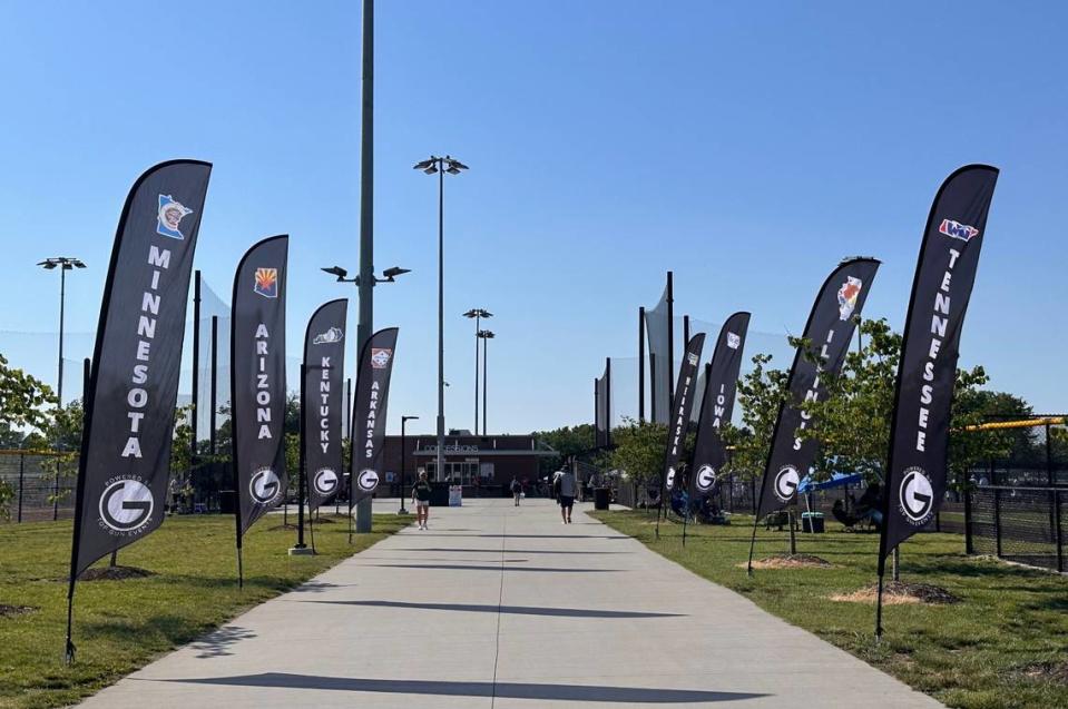 Flags of every state with a participating team at Kansas City’s annual Top Gun Softball Invitational sit along a walking path at Mid-America Sports Complex in Shawnee on June 13, 2024.