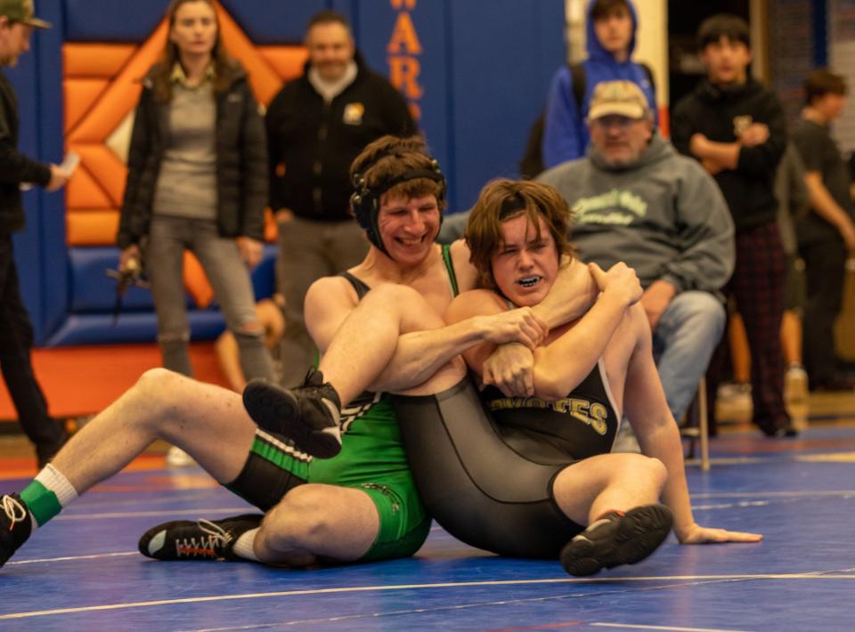 Robert Svitek (left) was one of five Thousand Oaks wrestlers to win league titles.