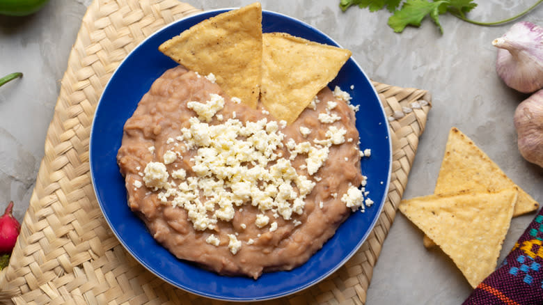 refried beans topped with cheese