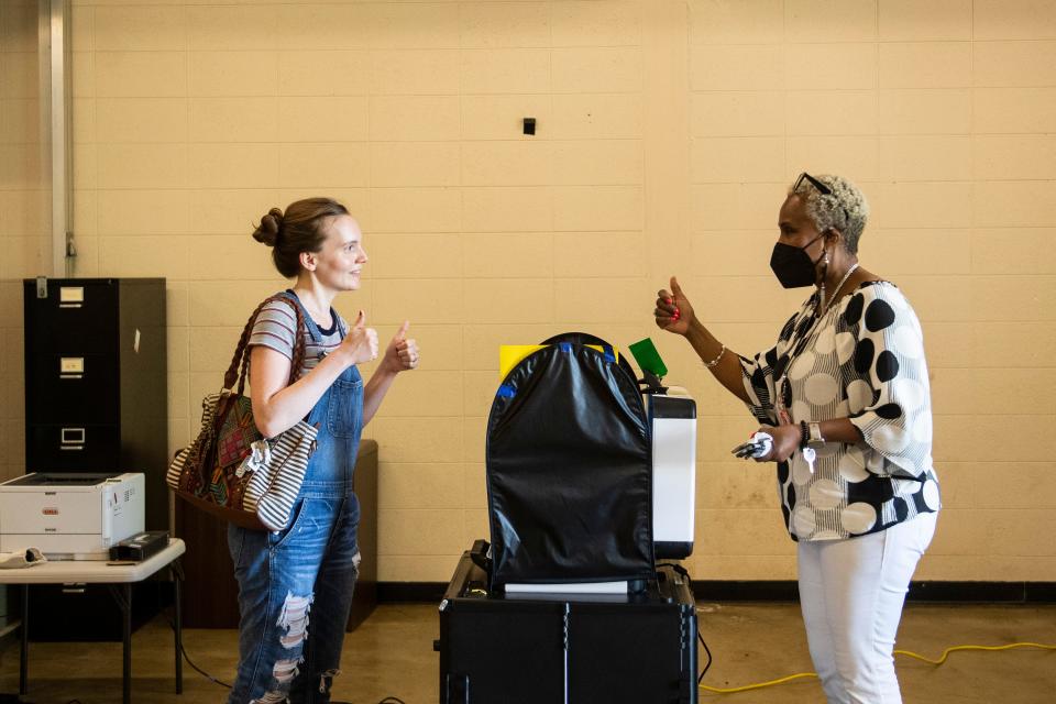 Voter Maggie Tharp, left, and Election Officer Tobertha Jackson give each other a thumbs up as Tharp cast her vote at the South Knoxville Optimist Club in Knoxville, Tenn on Thursday, August 4, 2022. 