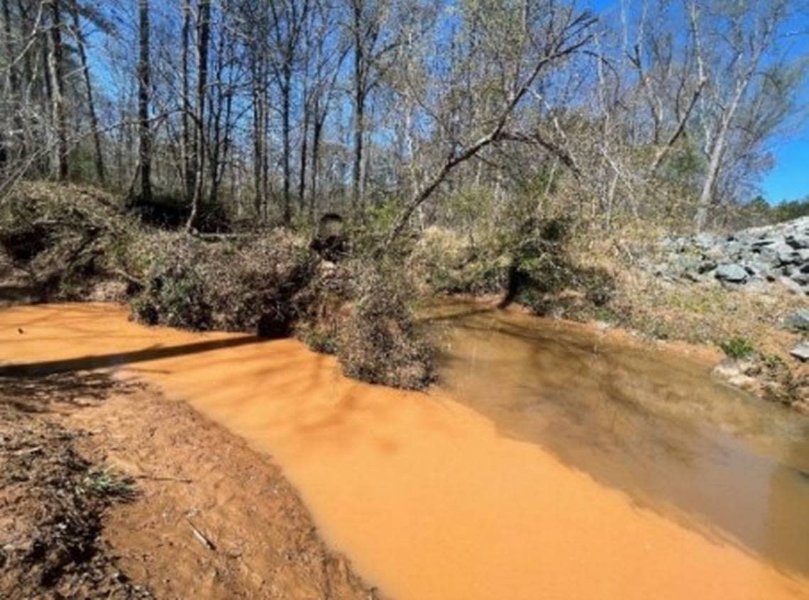 Sound Rivers and the Southern Environmental Law Center are suing Clayton Properties Group, alleging a development in Southeast Durham is resulting in significant sediment pollution to nearby waterways. The Sweetbrier development is allegedly sending sediment into Martin Branch, shown on the left here meeting Lick Creek before flowing into Falls Lake.