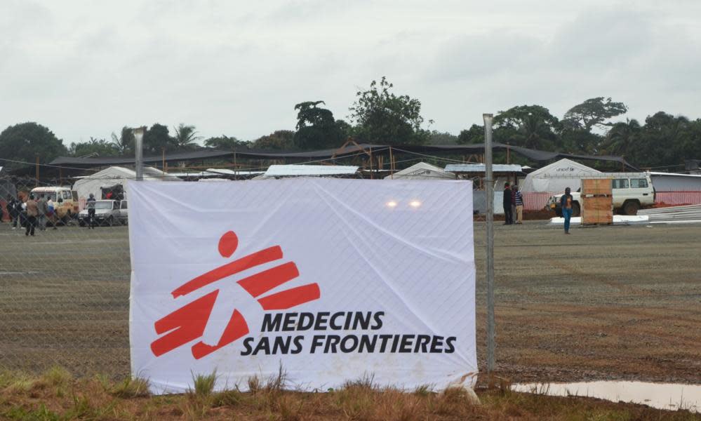 A Médecins Sans Frontières banner is seen on the fence of a hospital in Monrovia