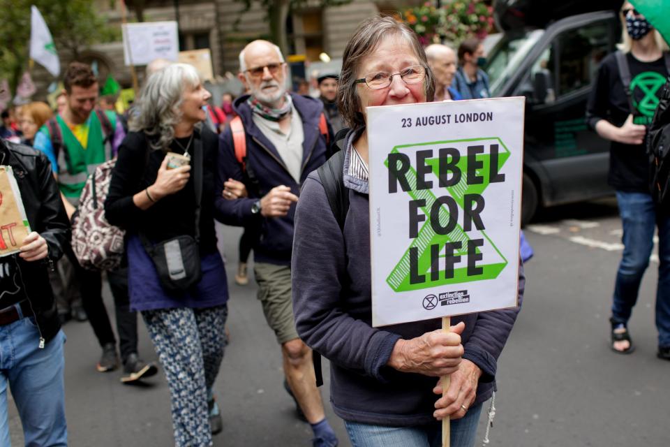 <p>LONDON, UNITED KINGDOM - AUGUST 23: Members of climate change activist movement Extinction Rebellion march along Charing Cross Road on the opening day of a planned two weeks of protests in London, United Kingdom on August 23, 2021. (Photo by David Cliff/Anadolu Agency via Getty Images)</p>
