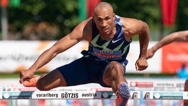 Damian Warner of London, Ont., captured the 110-metre hurdles in 13.36 seconds on Sunday en route to becoming the first person to win six Hypo Meeting decathlon titles in Gotzis, Austria. Warner compiled 8,995 points across 10 events over two days to surpass his Canadian record. (Dietmar Stiplovsek/APA/AFP via Getty Images - image credit)