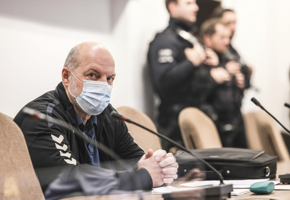 The defendant Thomas Drach sits in the dock in a courtroom in the Cologne Justice Center in Cologne, Germany, Thursday, Jan. 4, 2024. The German man who served prison time for a high-profile 1996 kidnapping was convicted of robbery and attempted murder on Thursday for his alleged role in a string of armed robberies in Germany in 2018 and 2019. The Cologne state court on Thursday sentenced Thomas Drach to 15 years in prison. (Oliver Berg/dpa via AP)