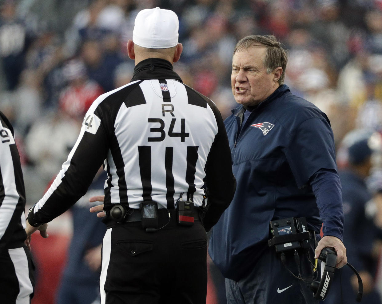 New England Patriots head coach Bill Belichick, right, argues a call with referee Clete Blakeman last season. (AP)