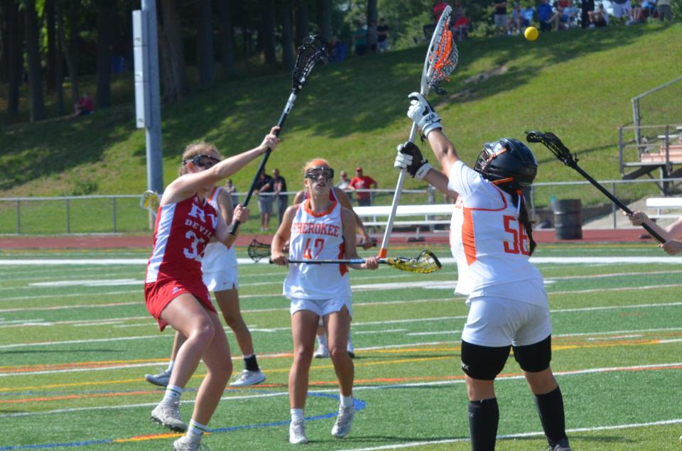 Rancocas Valley junior Elaina Corson fires a shot over the stick of Cherokee senior goalie Natalie Roesch