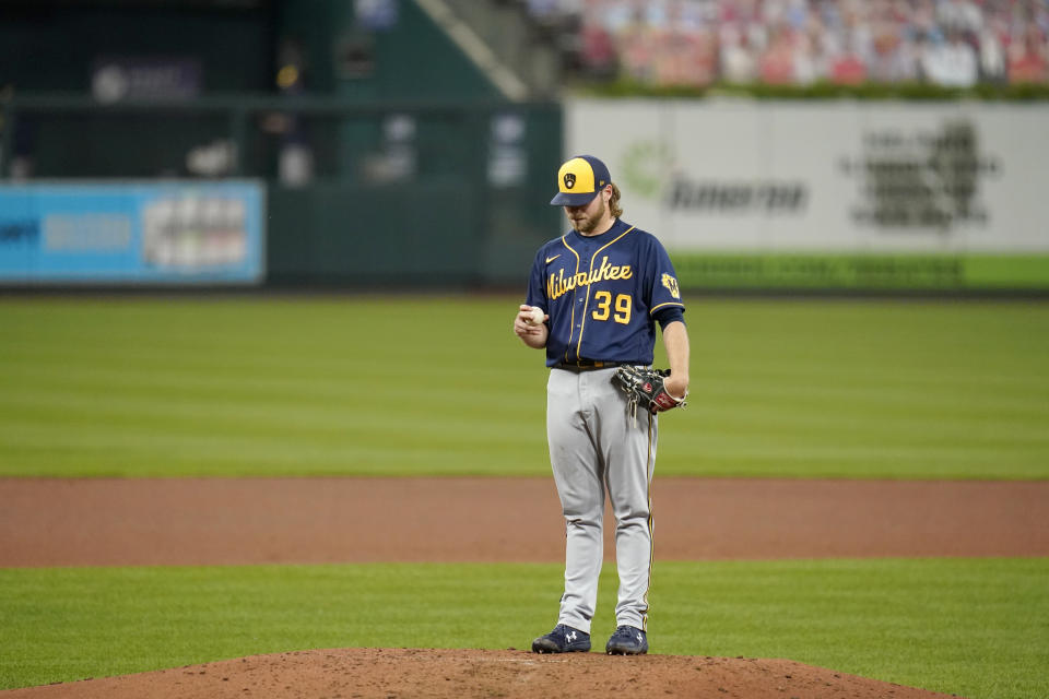 Milwaukee Brewers starting pitcher Corbin Burnes stands on the mound after giving up a two-run home run to St. Louis Cardinals' Dylan Carlson during the fourth inning of a baseball game Thursday, Sept. 24, 2020, in St. Louis. (AP Photo/Jeff Roberson)