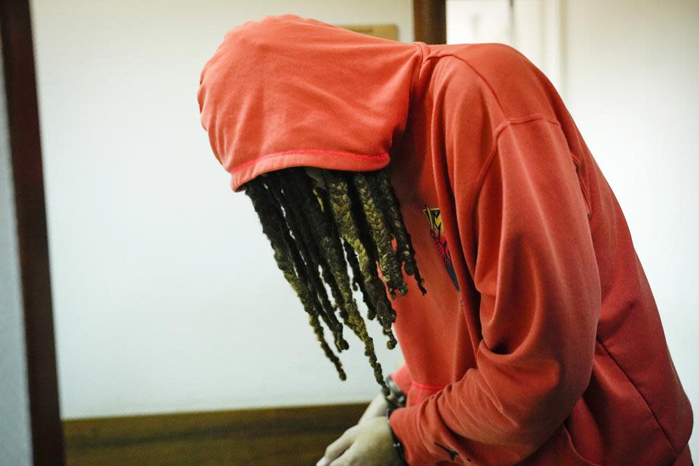 WNBA star and two-time Olympic gold medalist Brittney Griner leaves a courtroom after a hearing, in Khimki just outside Moscow, Russia, Friday, May 13, 2022. (AP Photo/Alexander Zemlianichenko)