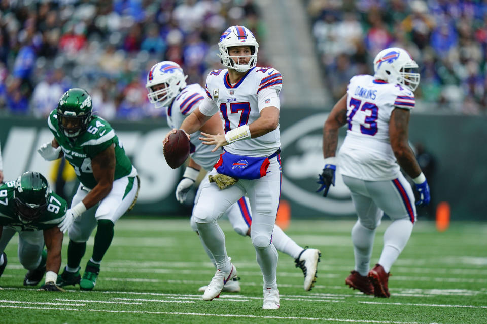 Buffalo Bills quarterback Josh Allen, center, looks to throw during the first half of an NFL football game against the New York Jets, Sunday, Nov. 14, 2021, in East Rutherford, N.J. (AP Photo/Frank Franklin II)