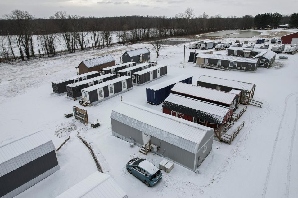 Temporary housing sits at Camp Graves, Monday, Jan. 15, 2024, in Water Valley, Ky. Two years after the tornado outbreak that killed dozens and leveled much of the real estate in Mayfield, many people are still living through another, slower disaster, the search for housing. (AP Photo/Joshua A. Bickel)