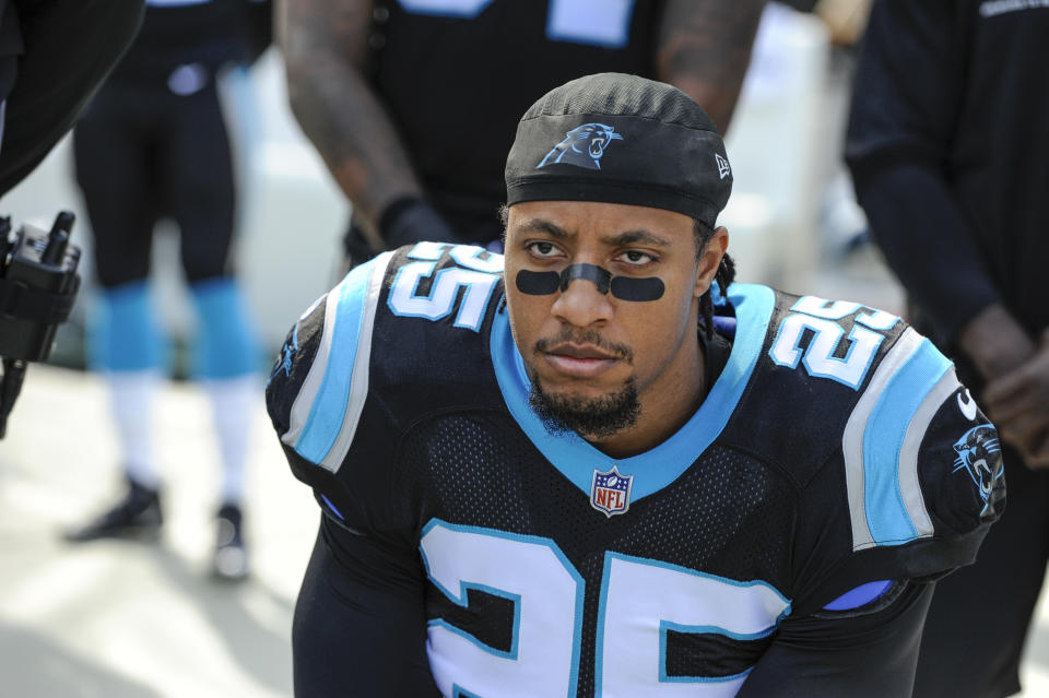 FILE - In this Nov. 25, 2018, file photo, Carolina Panthers strong safety Eric Reid (25) knells along the sideline during the national aAnthem before the start of an NFL football game against the Seattle Seahawks in Charlotte, N.C. Reid says he is “not surprised” he has been drug tested by the NFL six times in the past 11 weeks, his Panthers teammates and coaches are growing increasingly annoyed at the frequency of the league’s “random” policy. (AP Photo/Mike McCarn, File)