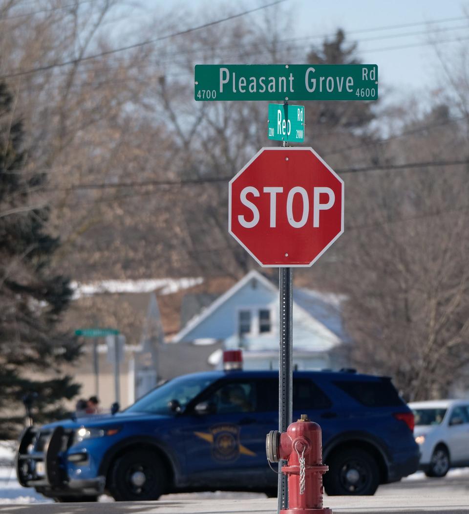 Lansing and Michigan State Police blocked off Pleasant Grove Road between Holmes Road and  Jolly Road Saturday as they negotiated with a barricaded gunman Saturday, Jan. 8, 2022. Police found the body of a woman in the home following the nine-hour standoff.