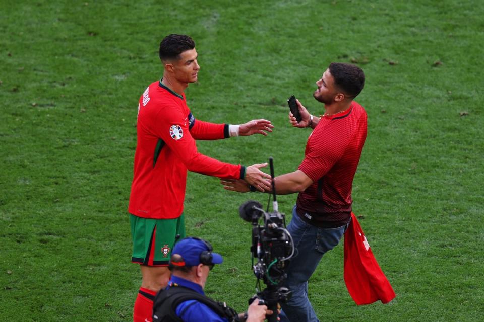 Ronaldo became frustrated as more fans wre abel to make it onto the pitch (Getty Images)