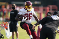 Washington running back Adrian Peterson runs during practice at the team's NFL football training facility, Tuesday, Aug. 25, 2020, in Ashburn, Va. (AP Photo/Alex Brandon)