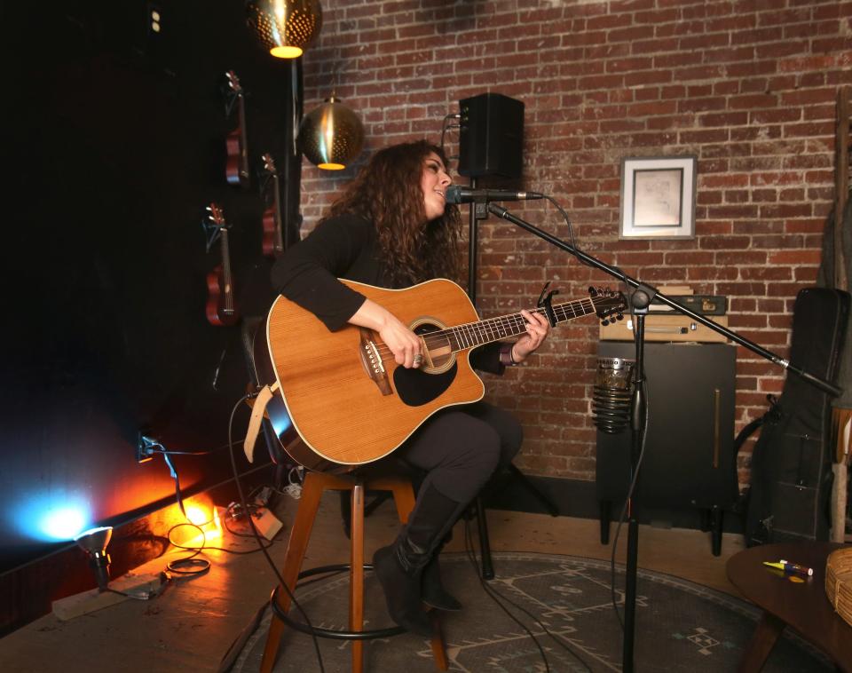 Tawnya Reynolds performs in late March at Downtownhecks Tap Room in downtown Massillon. A former contestant on u0022The Voiceu0022 television show, Reynolds is among the musicians who gets booked at the venue, which features more than 100 craft beers, with 24 on tap, along with a full bar.