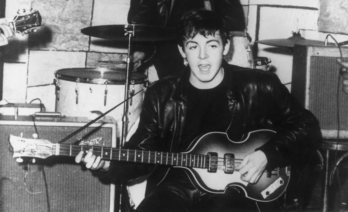 Paul McCartney on stage at the Cavern Club in Liverpool with his Hofner bass in the early 1960s (Keystone/Getty)