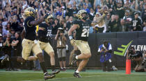 Colorado linebacker Carson Wells celebrates as he crosses into the end zone to score a touchdown on a pass interception against Arizona in the second half of an NCAA college football game Saturday, Oct. 16, 2021, in Boulder, Colo. (AP Photo/David Zalubowski)