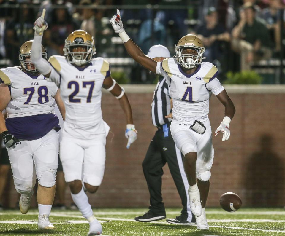 Male's Demtrius Dunlap, right, celebrates after his fumble recovery at Marshall Stadium. Sept. 16, 2022