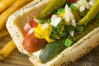 <p>While there are dozens of <a href="https://www.thedailymeal.com/cook/8-creative-hot-dog-recipes-slideshow?referrer=yahoo&category=beauty_food&include_utm=1&utm_medium=referral&utm_source=yahoo&utm_campaign=feed" rel="nofollow noopener" target="_blank" data-ylk="slk:regional hot dog styles;elm:context_link;itc:0;sec:content-canvas" class="link ">regional hot dog styles</a>, few are as beloved as the “dragged through the garden” <a href="https://www.thedailymeal.com/cook/chicago-style-hot-dog-recipe?referrer=yahoo&category=beauty_food&include_utm=1&utm_medium=referral&utm_source=yahoo&utm_campaign=feed" rel="nofollow noopener" target="_blank" data-ylk="slk:Chicago-style hot dog;elm:context_link;itc:0;sec:content-canvas" class="link ">Chicago-style hot dog</a>. An all-beef <a href="https://www.thedailymeal.com/eat/healthiest-unhealthiest-store-bought-hot-dogs?referrer=yahoo&category=beauty_food&include_utm=1&utm_medium=referral&utm_source=yahoo&utm_campaign=feed" rel="nofollow noopener" target="_blank" data-ylk="slk:hot dog;elm:context_link;itc:0;sec:content-canvas" class="link ">hot dog</a> is tucked into a poppy seed bun and topped with mustard, celery salt, relish, onion, pickle spears, sport peppers and tomatoes. Ketchup need not apply.</p> <p><a href="https://www.thedailymeal.com/recipes/chicago-style-hot-dog-recipe-0?referrer=yahoo&category=beauty_food&include_utm=1&utm_medium=referral&utm_source=yahoo&utm_campaign=feed" rel="nofollow noopener" target="_blank" data-ylk="slk:For the Chicago-Style Hot Dog recipe, click here.;elm:context_link;itc:0;sec:content-canvas" class="link ">For the Chicago-Style Hot Dog recipe, click here.</a></p>