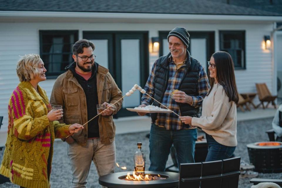 Guests at the Bardstown Motor Lodge roast marshmallows for s’mores in the courtyard in Bardstown, Ky. Bardstown Motor Lodge