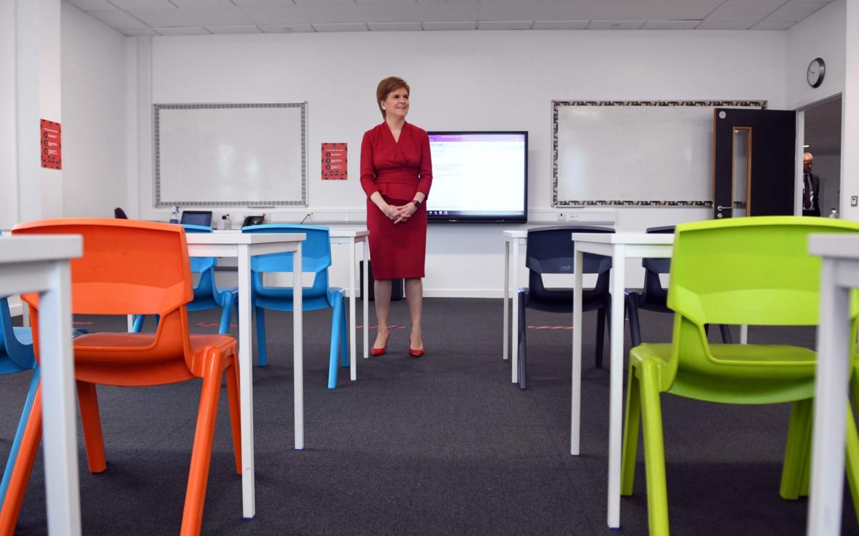 Nicola Sturgeon views a classroom as she visits West Calder High School - Andy Buchanan / POOL / AFP