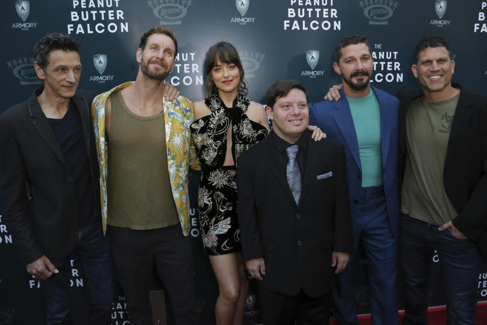 John Hawkes, from left, Tyler Nilson, Dakota Johnson, Zack Gottsagen, Shia LaBeouf and Michael Schwartz attend the LA Special Screening of "The Peanut Butter Falcon" at The ArcLight Hollywood on Thursday, Aug. 1, 2019, in Los Angeles. (Photo by Willy Sanjuan/Invision/AP)