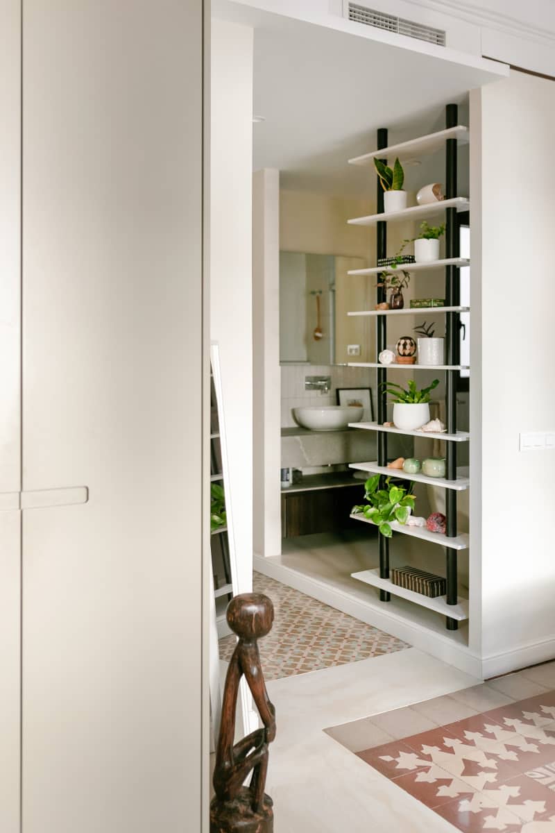 Modern floating shelves in hallways with plants on display