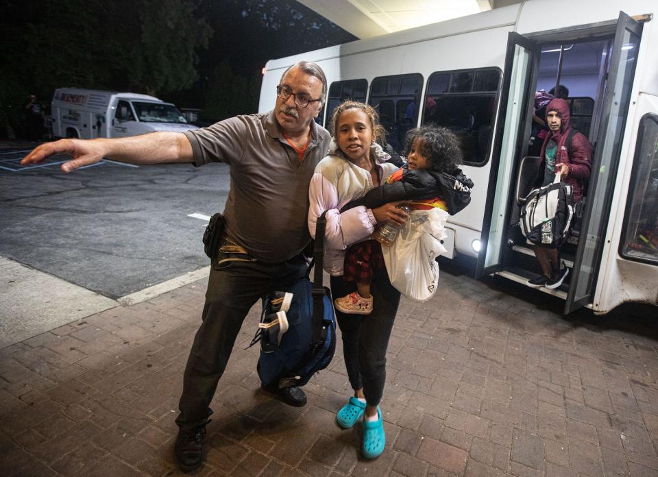 Families of asylum seekers are led into the Ramada hotel in Yonkers May 15, 2023. The families were being housed in New York City.