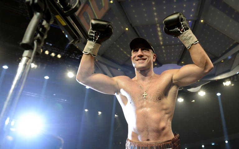 Armenian-German super middleweight boxer Arthur Abraham celebrates victiory over French challenger Mehdi Bouadla after the WBO Super-middleweight title boxing match in Nuremberg, southern Germany on December 15, 2012. Abraham won the fight in the 8th round