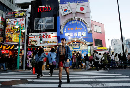 Nao Niitsu, 19, a college freshman from Tokyo, who wants to be a K-pop star, walks through Shin-Okubo district, which is known as Tokyo's Korea Town, in Tokyo, Japan, March 21, 2019. REUTERS/Kim Kyung-Hoon