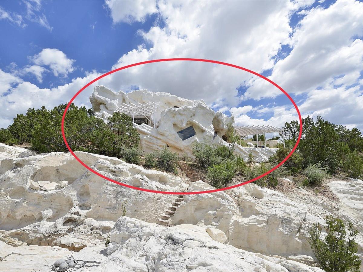 A Santa Fe jeweler covered her 1-bedroom house in foam so it would blend right in with the limestone cliffs it sits on. It's on the market for $899,000.