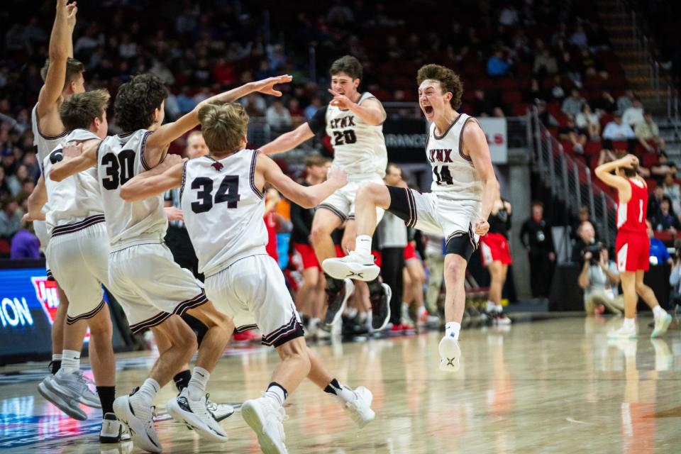 North Linn celebrates their win over Marquette Catholic in the Class 1A championship Friday, March 8, 2024, at Wells Fargo Arena.