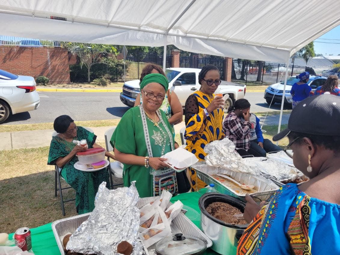 One of the vendors serving food at the inaugural International Taste of St. Eugene Food Festival hosted by St. Eugene Catholic Mission and Student Center in 2022.