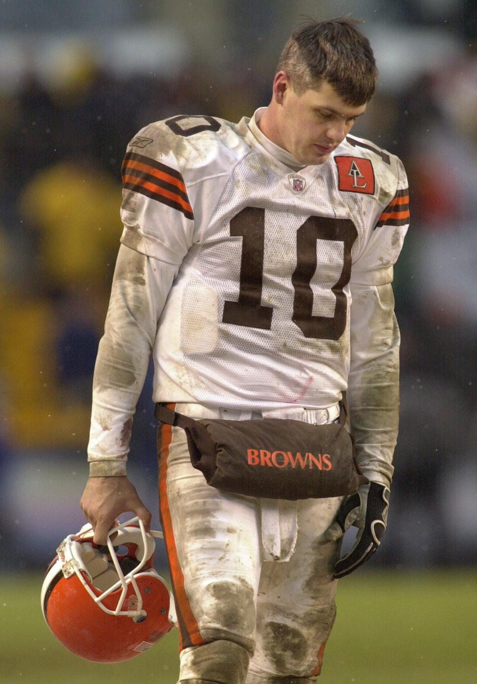 Cleveland Browns quarterback Kelly Holcomb walks the sidelines as the Pittsburgh Steelers complete a 36-33 comeback win.