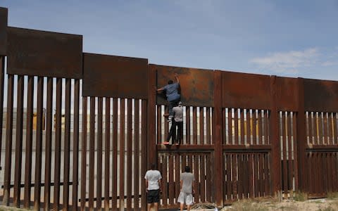 Mr Trump has said the wall is needed to curb illegal immigration and drug trafficking - Credit: AFP