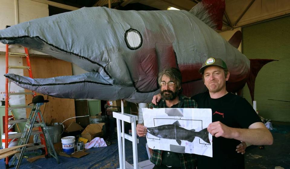 Emmett Riddels(R) and his cohort Badger have hooked up for their first-ever Procession of the Species parade project, an over 20-foot likeness of a spawning salmon. Currently being created at the Procession studio at the Olympia Armory Creative Campus the giant moveable salmon will be ready for the annual community parade this Saturday. Photo taken April 24, 2024