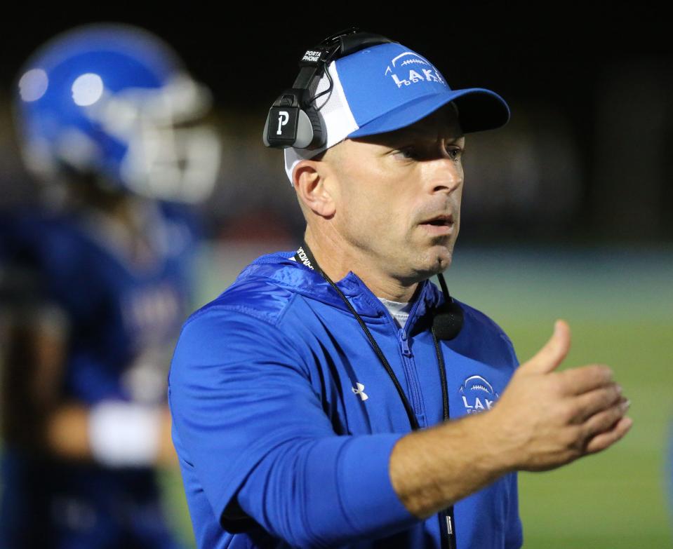 Lake head coach Dan DeGeorge gestures during a Sept. 24, 2021 high school football game against Jackson at Lake.