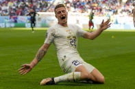 Serbia's Sergej Milinkovic-Savic celebrates after scoring his side's second goal during the World Cup group G soccer match between Cameroon and Serbia, at the Al Janoub Stadium in Al Wakrah, Qatar, Monday, Nov. 28, 2022. (AP Photo/Frank Augstein)