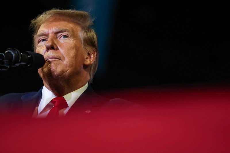 FILE PHOTO: Former U.S. President Donald Trump attends a campaign event in Conway