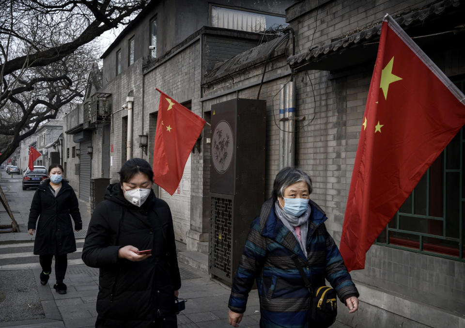 Image: Women wear protective masks in the midst of a coronavirus outbreak in Beijing on Jan. 28, 2020. (Kevin Frayer / Getty Images file)