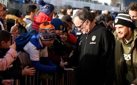 Leeds manager Marcelo Bielsa signs autographs - Credit: getty images