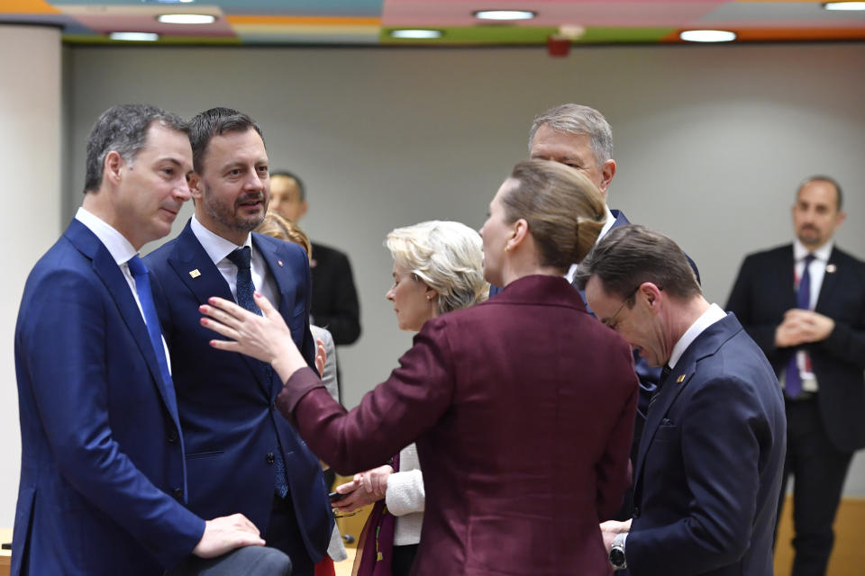 Denmark's Prime Minister Mette Frederiksen, center right, speaks with Slovakia's Prime Minister Eduard Heger, second left, and Belgium's Prime Minister Alexander De Croo, left, during a round table meeting at an EU summit in Brussels, Friday, March 24, 2023. European leaders gather Friday to discuss economic and financial challenges and banking rules, seeking to tamp down concerns about eventual risks for European consumers from banking troubles in the US and Switzerland. (AP Photo/Geert Vanden Wijngaert)