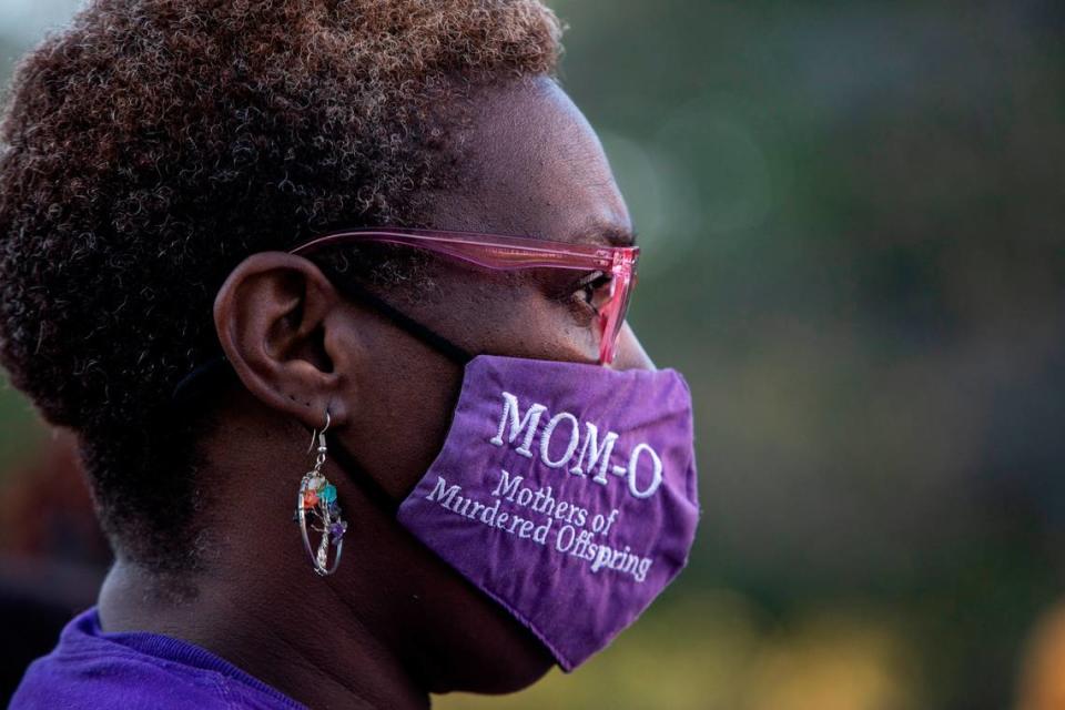 Tawanna Wilson wears a Mothers of Murder Offspring mask as she mourns her late child, Shawn Sinclair, at the National Day of Remembrance for Murder Victims on Friday September 23, 2022 in Charlotte, NC.