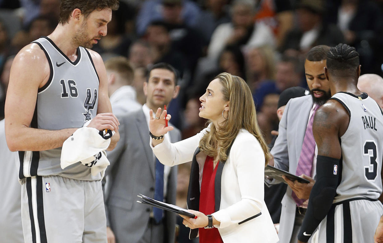 Spurs assistant coach Becky Hammon goes over the game plan with San Antonio’s Pau Gasol. (Getty Images)