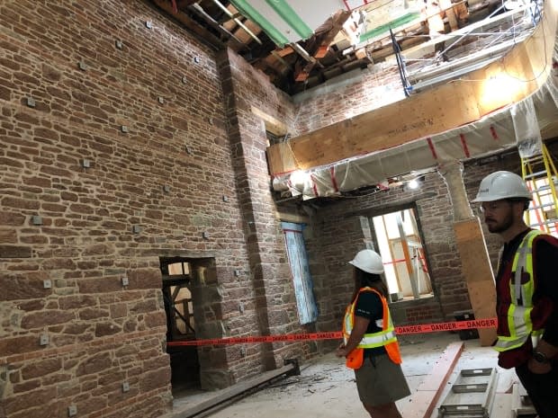About 20 per cent of the stone blocks in this interior wall of the Confederation Chamber of Province House have been replaced with new ones. The wall is now structurally sound, according to site officials, and further restoration work can proceed. (Brian Higgins/CBC - image credit)