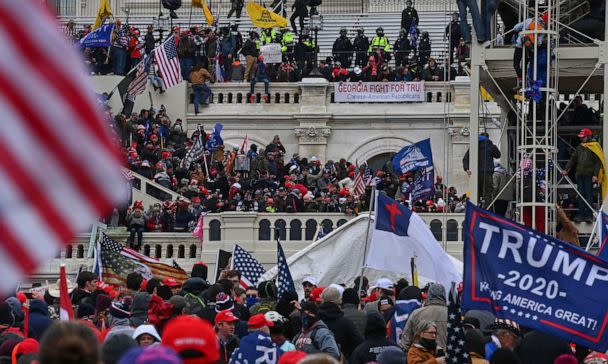 PHOTO: Protesters take over the Inaugural stage during a protest calling for legislators to overturn the election results in President Donald Trump's favor at the Capitol, Jan. 6, 2021. (The Washington Post via Getty Images)