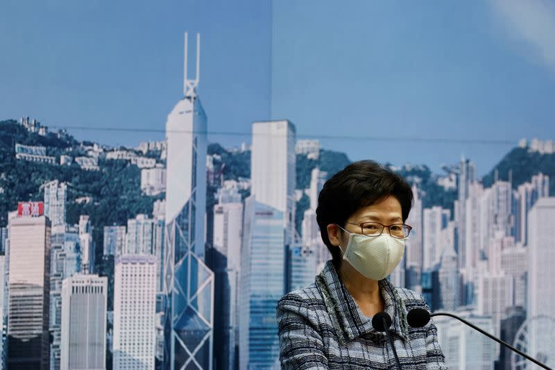 Hong Kong's Chief Executive Carrie Lam attends a news conference to announce a postponement of her annual policy address, in Hong Kong